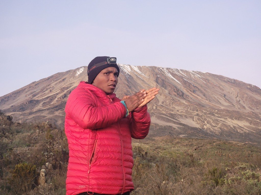 Abdala Adam Oka on Kilimanjaro in expedition gear